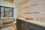 Inspiring design in this fabulous bathroom with shower and enclosed bathtub